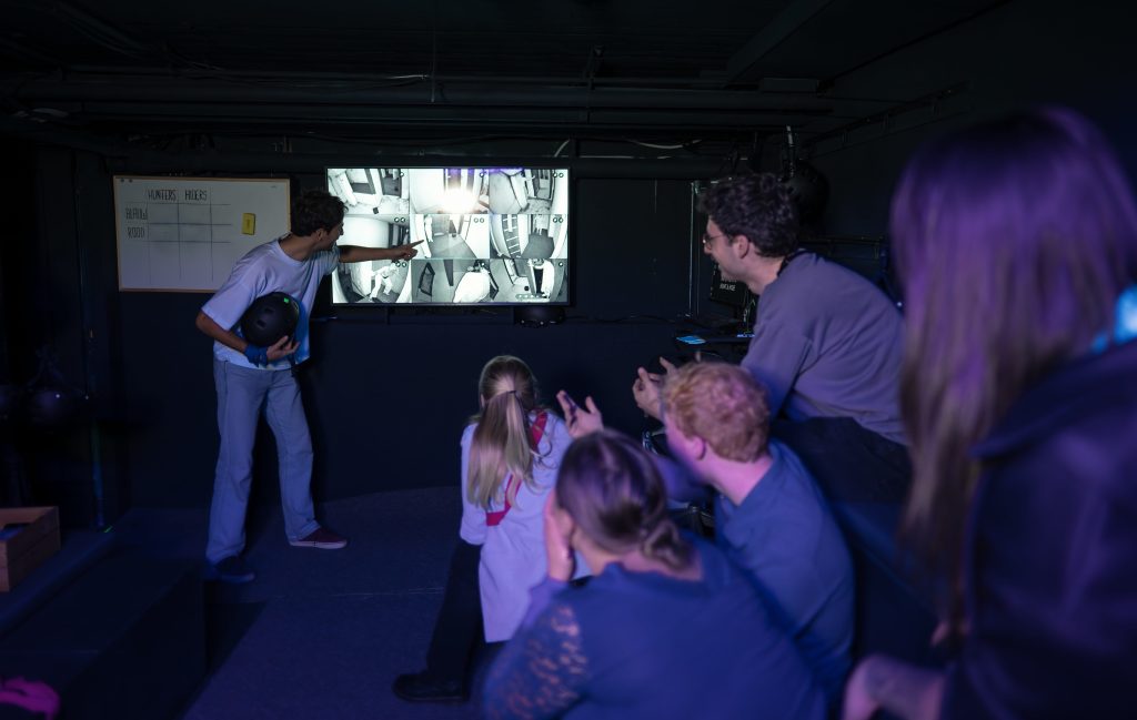 International team working together on a challenge in the Nox Room in Utrecht